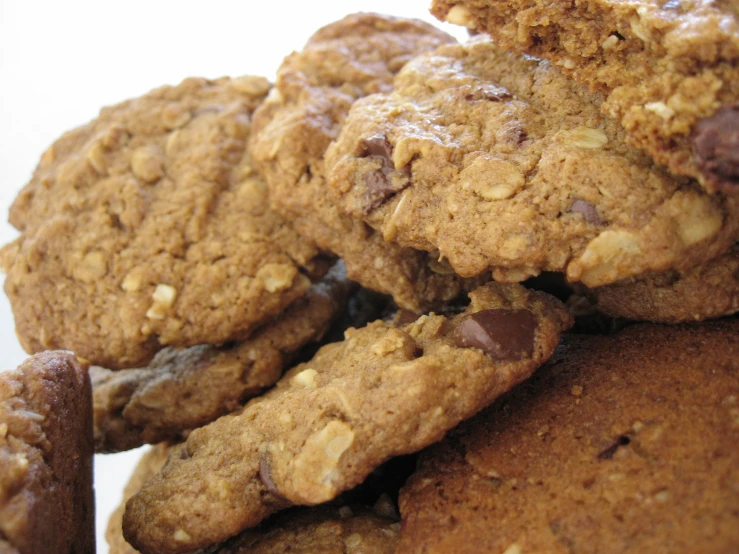 a plate of cookies and muffins are piled together