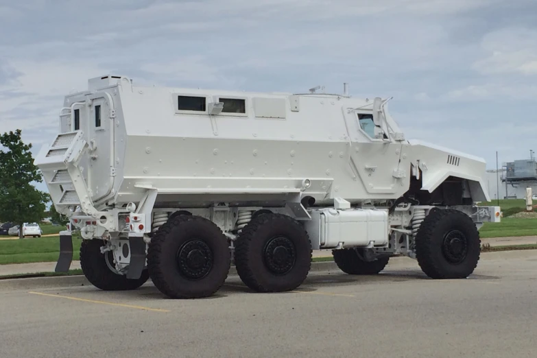 a large armored truck on a street side