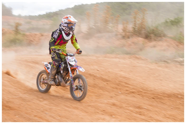 an image of a man that is on a dirt bike