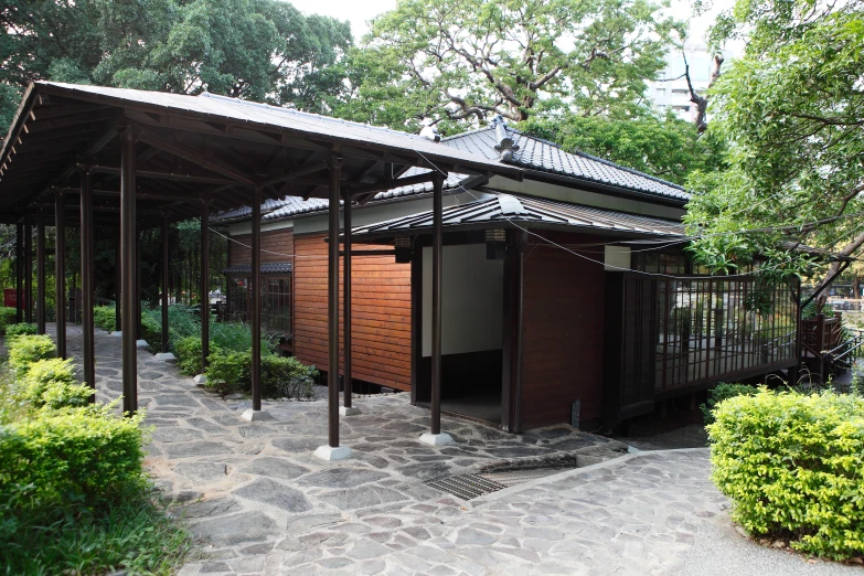 an old style building sitting among trees and plants