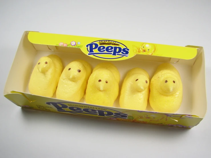 peeps are in a carton on a table