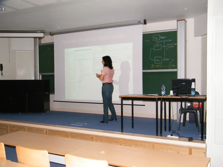 a young lady is giving a class to her peers