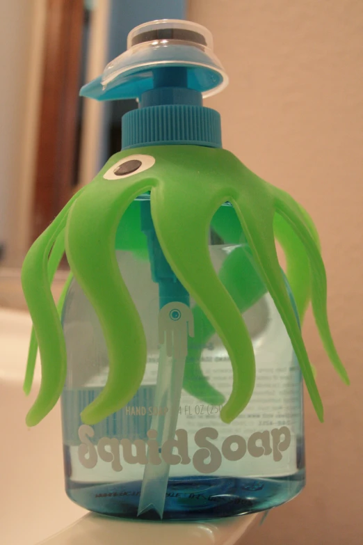 an octo themed toothbrush holder is on the counter