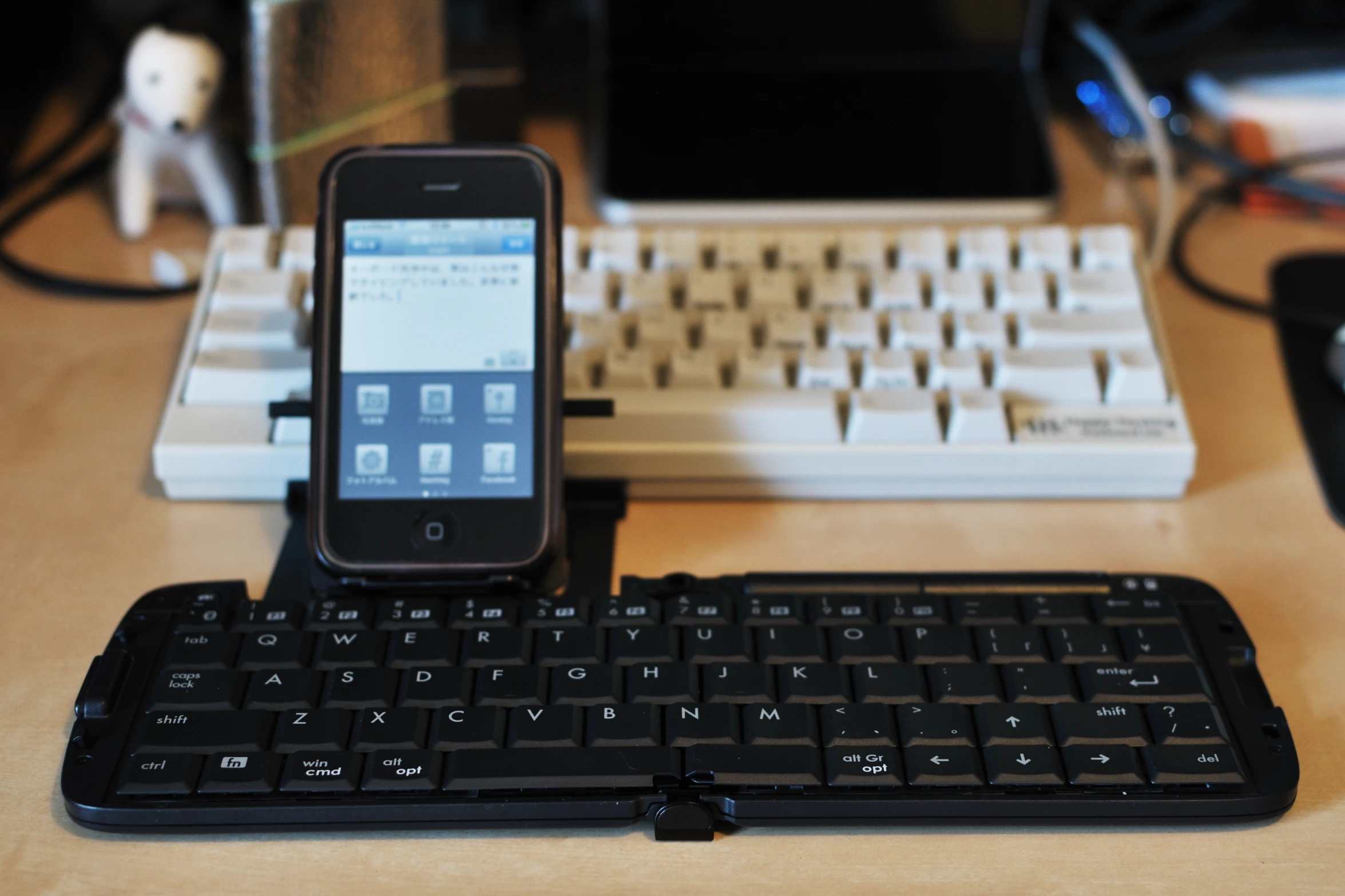 an iphone that is on a keyboard