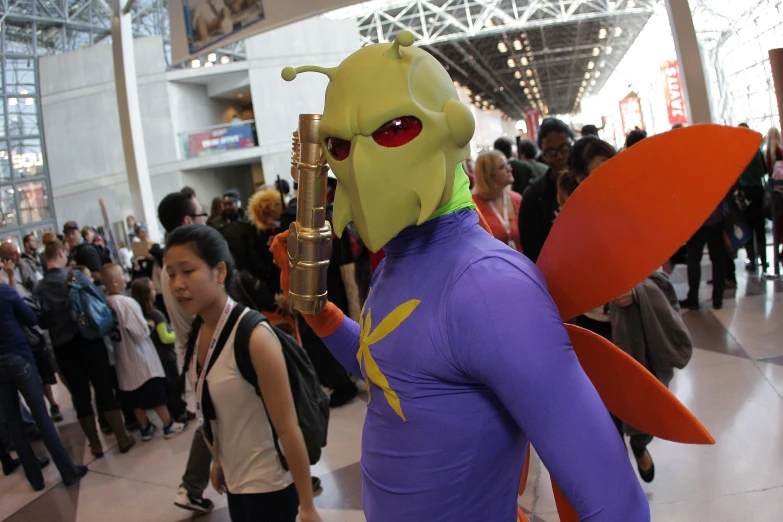 there is a very large male cosplay holding a pipe