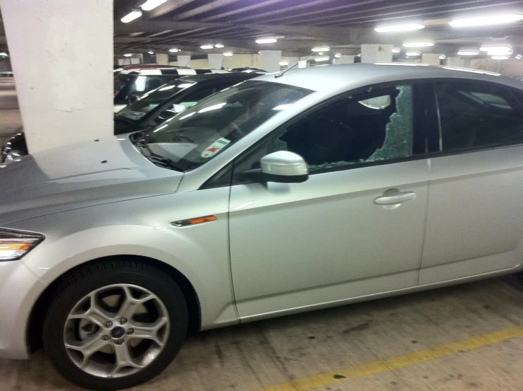 several cars parked in an underground parking garage