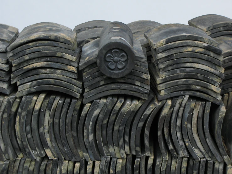several black pieces of tires piled together