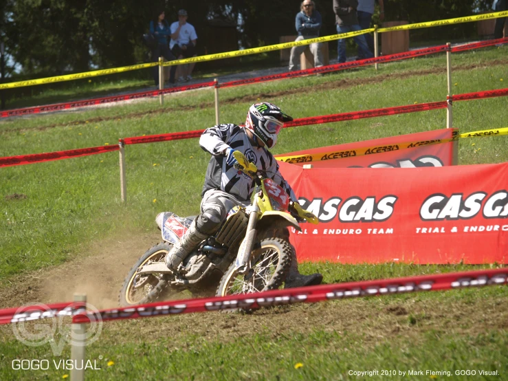 a man riding on the back of a dirt bike