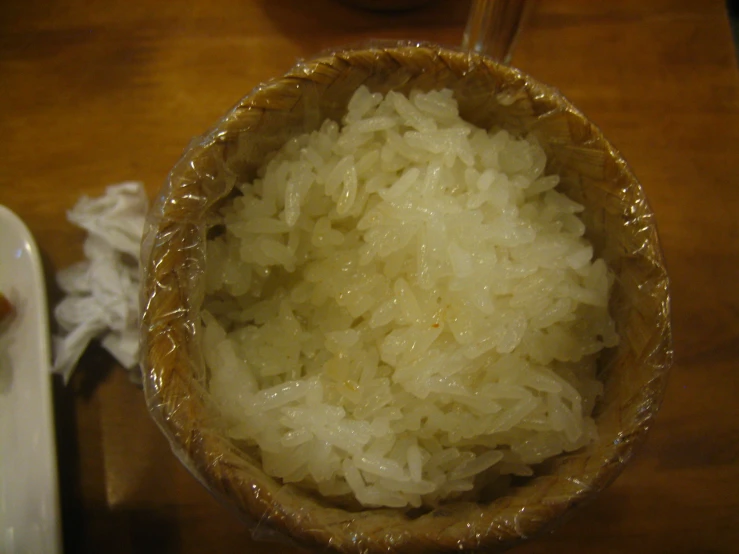 an image of bowl full of white rice on a table