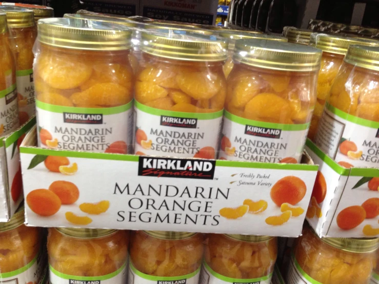 jars of mandarin orange segments are for sale in a store