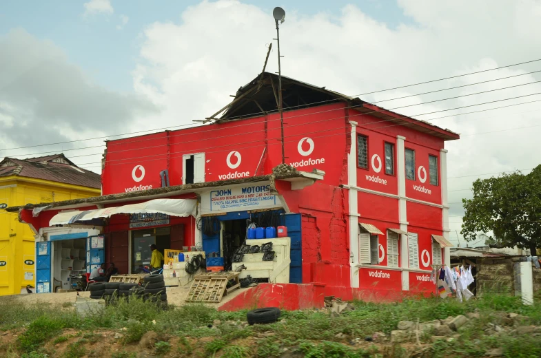 two buildings near each other, each painted red