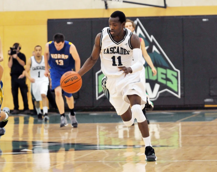 an image of a man running toward the basket