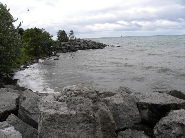 rocky shore next to a large body of water