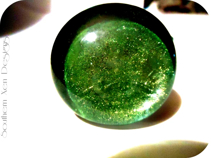 a closeup of a green circular object