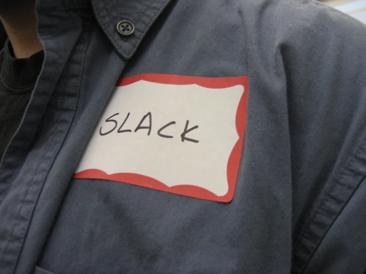 a blue jacket that has the word black pinned to it