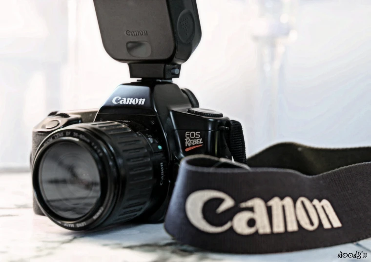 the camera is equipped with a black strap