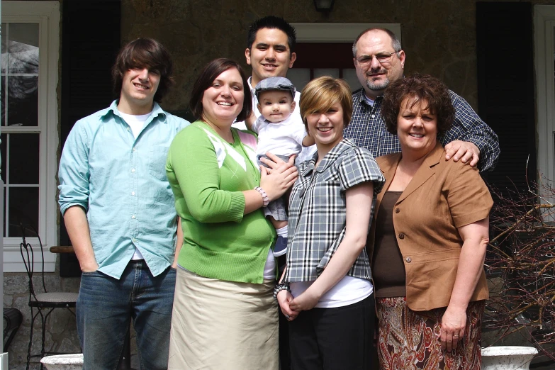 a family is posing for a group po