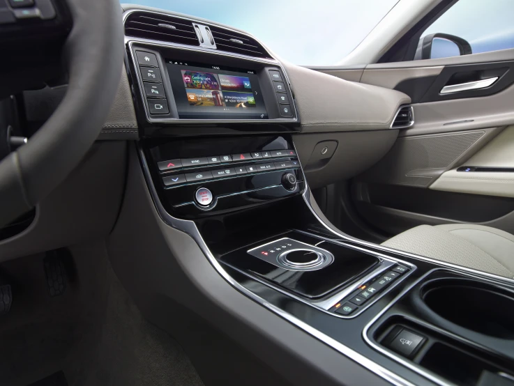 the dashboard of a car has several electronic devices