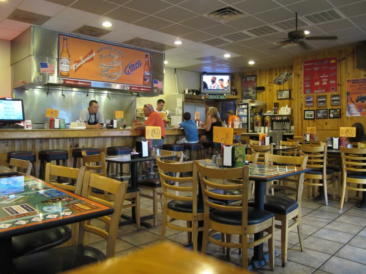 a diner sitting at the counter with food