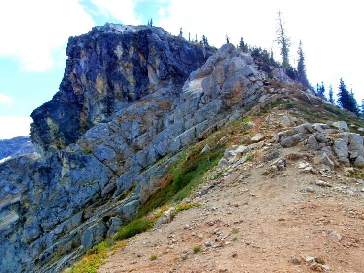 a big mountain with some very tall rocks on it