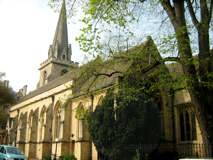 an old building with tall spires with green ivy on it