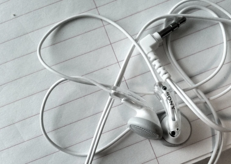 two ear phones with wires connected to each other