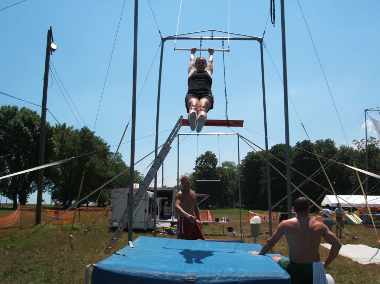 a woman who is falling off of a high jump