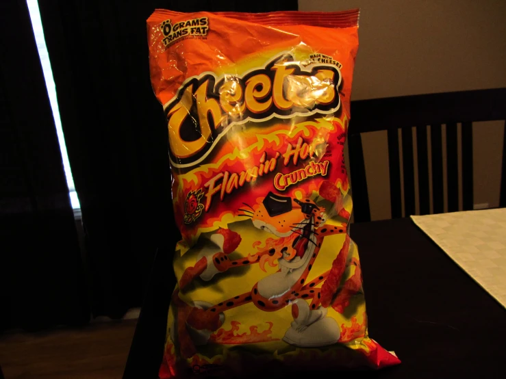 a bag of cheetos sitting on top of a table