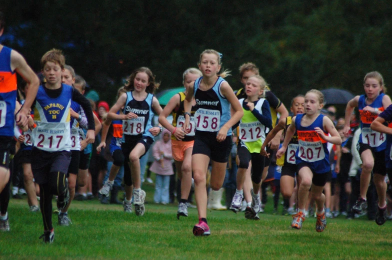 s race down the track in a group