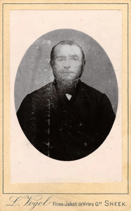 an old fashioned po of a man with a beard