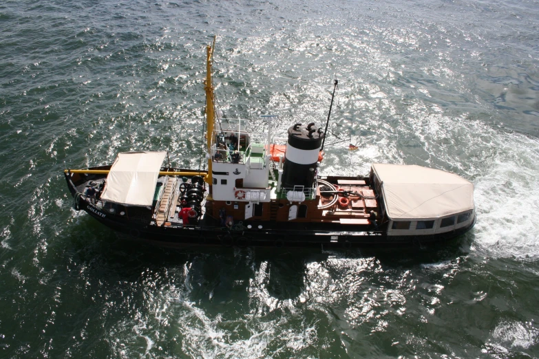 a small boat sailing through open water