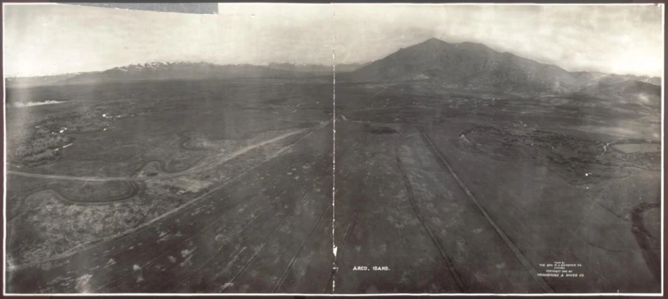 an old po of a large field with trees