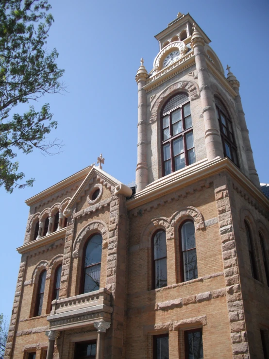 this is an old stone building with a clock on top