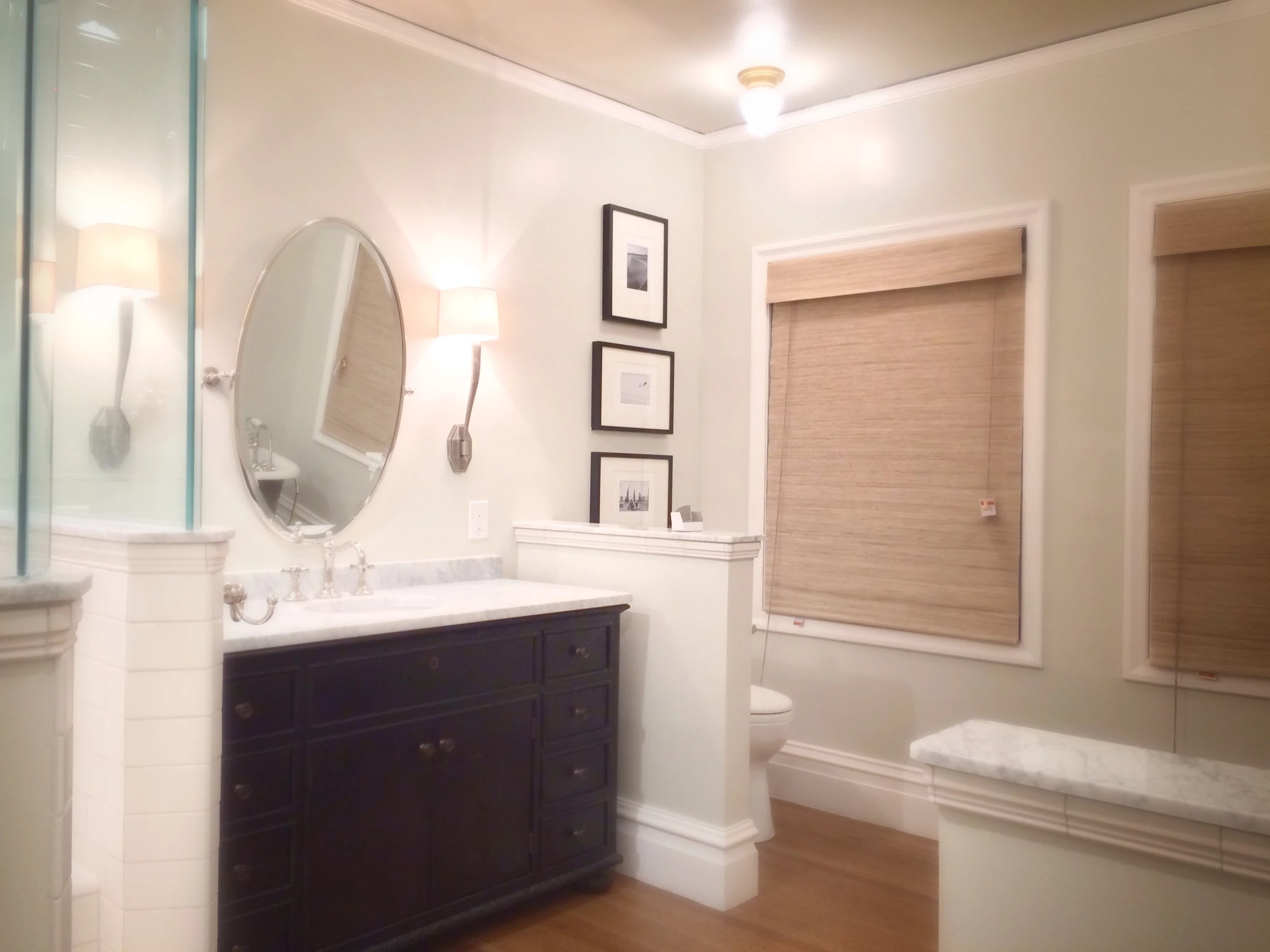 a white and brown bathroom with two sinks