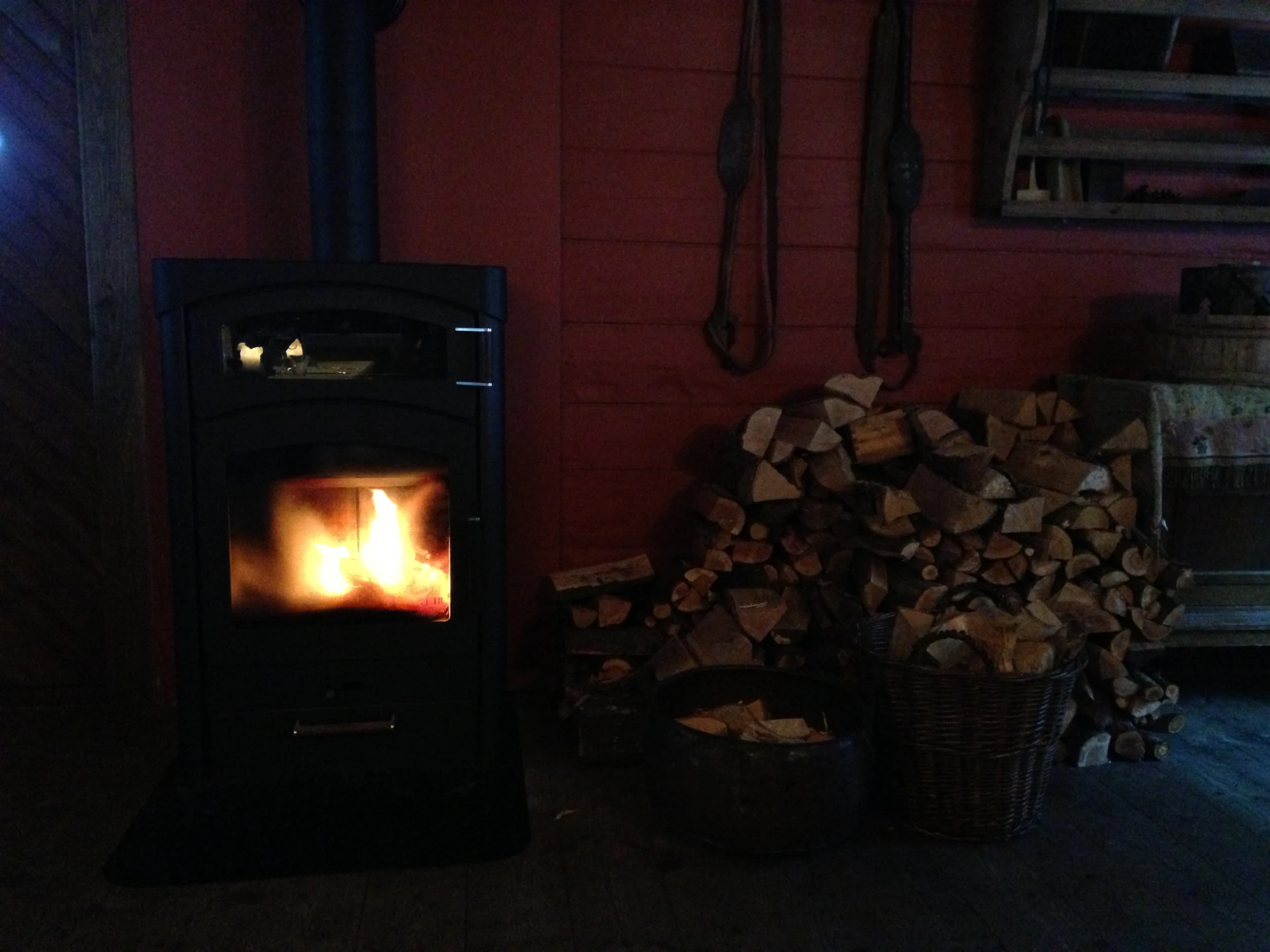 fire in a wood burning fireplace in a cabin