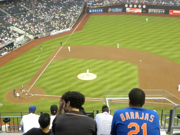 a baseball field with players on the field