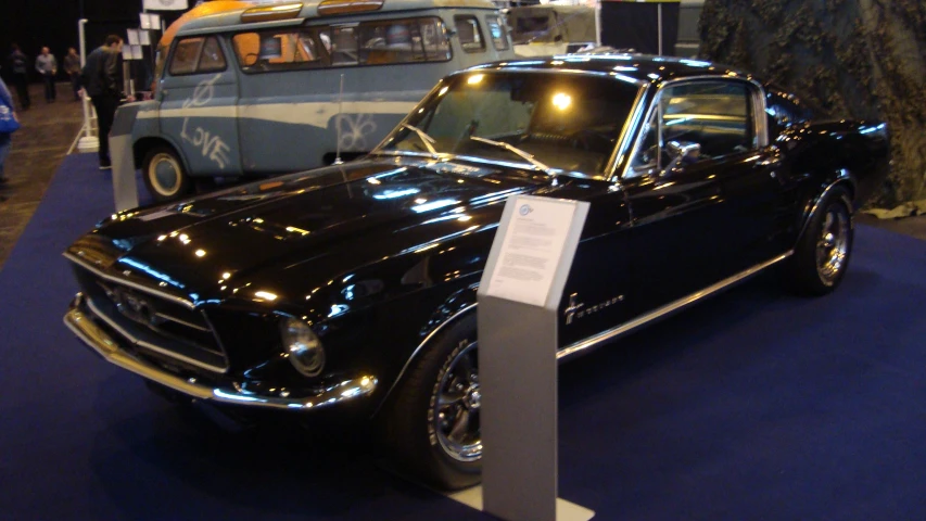 an old model black car on display in a museum