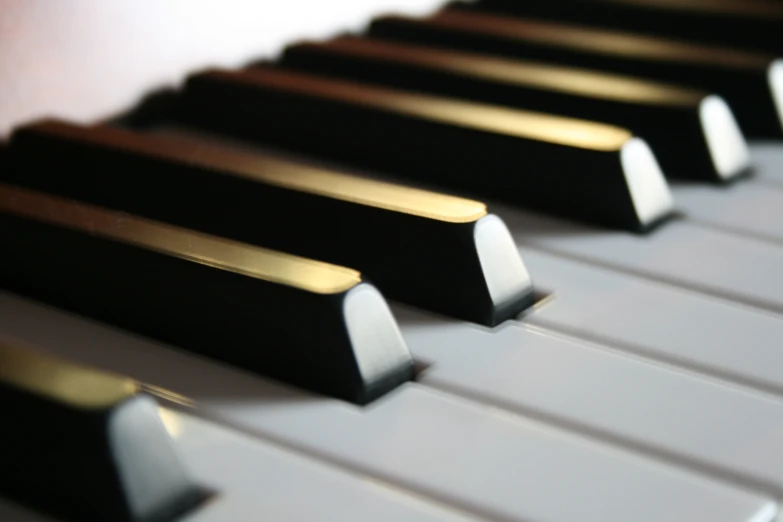 there are black and white piano keys on a shelf