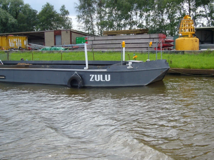 a large boat floating in the water on a river