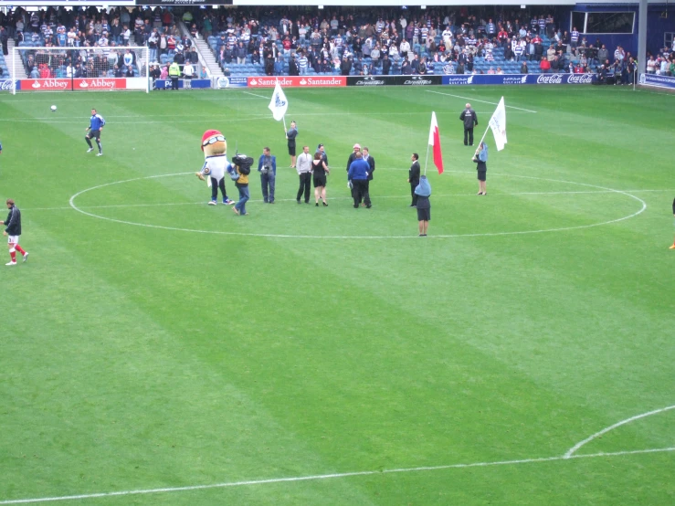 a man holding a flag at a soccer game