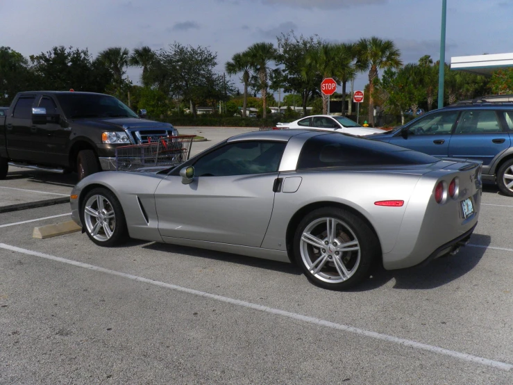 a silver sports car in a parking lot