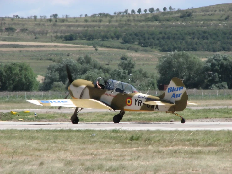 a fighter jet sitting on top of an airport tarmac