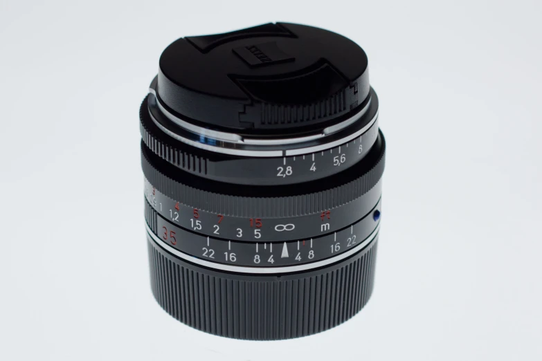 a camera lens on top of a cup