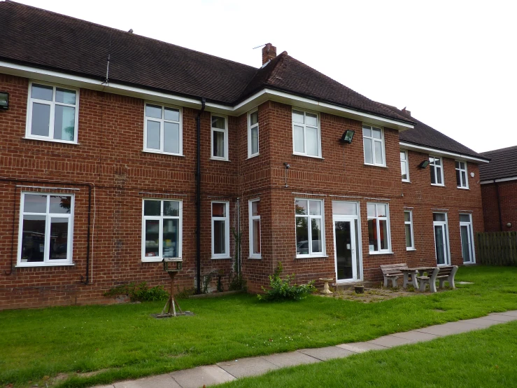 this is an image of a house with a lawn in front