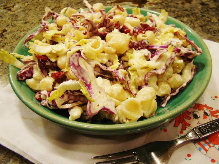 this salad has onions, cabbage and red cabbage