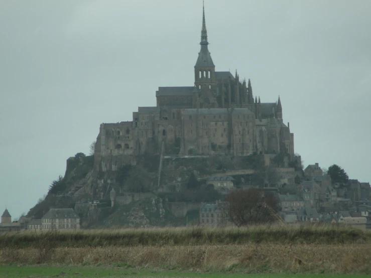 an image of a castle sitting on top of a hill