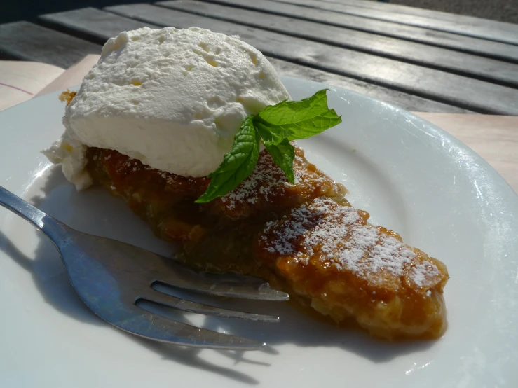 a white plate topped with an apple pie