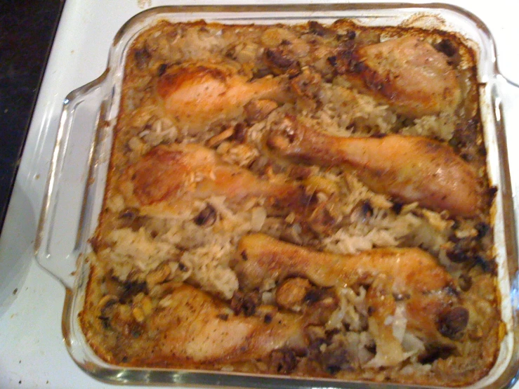 a cooked dish of food in a glass container on a stove