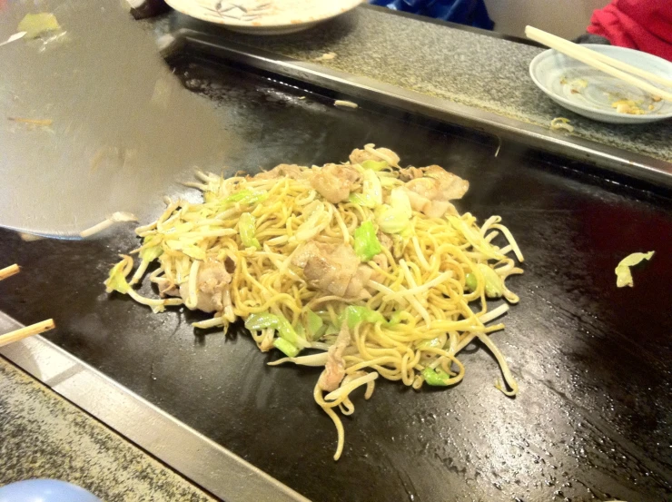 a plate filled with food sitting on a table