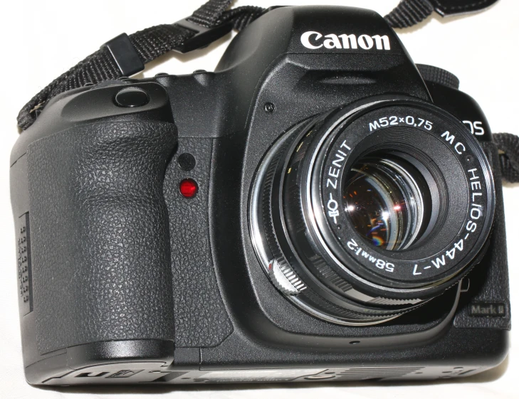 a canon dslr camera showing the lens and hood